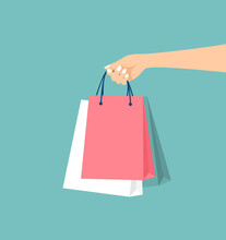 Female Hand Holding Packages On A Green Background. Shopping Concept. Vector Illustration In Flat Style