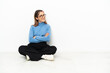 © luismolinero - Young Caucasian woman sitting on the floor with arms crossed and happy