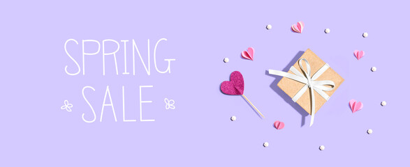Wall Mural - Spring sale message with a small gift box and hearts