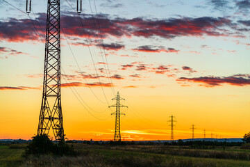 Wall Mural - Detail of electric pole with electric cables at sunset