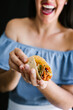 © Marcos - Mexican woman preparing tacos al pastor and eating mexican food in Mexico Latin America