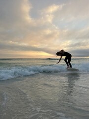 silhouette of a surfer