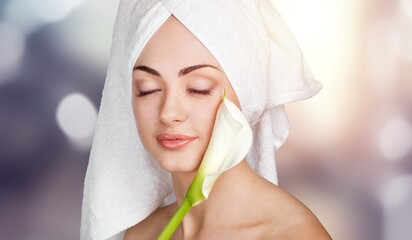 Canvas Print - Happy young woman after facial treatment.