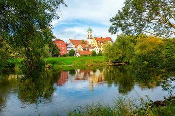 Wall Mural - View of the Rococo style St. Mang Church and monastery complex in the Stadtamhof village island area, across the Danube River from the Bavarian town of Regensburg, Germany.