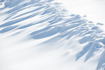 Wall Mural - abstract shadow and light patterns in white winter snow background
