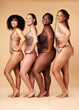 © Nina L/peopleimages.com - Diversity women, skin and body positivity portrait of friends together for inclusion, beauty and power. Underwear model group on beige background with cellulite, pride and motivation for self love