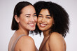 © Nina L/peopleimages.com - Diversity, beauty and portrait of women for skincare, wellness and body positivity in studio. Dermatology, self love and face of Asian and black girl for luxury cosmetics, makeup and natural glow