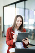 © Jirapong - business owner or Asian female marketers are using tablet computer in office work