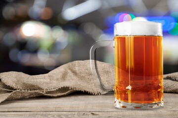 Poster - Pint glass of beer in bar on the desk