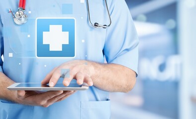 Doctor shows health care icon system on screen.