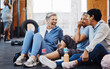 © S Fanti/peopleimages.com - Gym, laughing and group of mature women telling joke after fitness class, conversation and comedy on floor. Exercise, bonding and happy senior woman with friends sitting chatting together at workout.