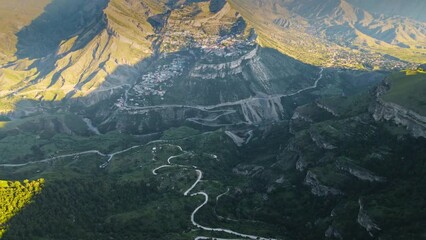 Wall Mural - Gunib village in the mountains of Dagestan, Caucasus, Russia. Aerial drone view. Summer landscape at sunrise.
