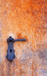 old weathered iron door with door handle