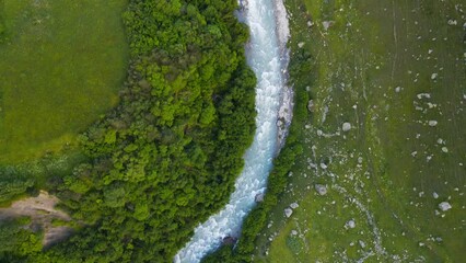 Wall Mural - Mountain river with green trees. Aerial drone view. Abstract summer nature background.
