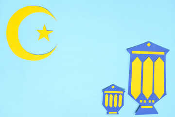 Wall Mural - Crescent moon, star and lantern decoration template flat lay in blue background. Islam Ramadan Kareem celebration of holy month.