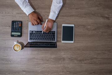 Wall Mural - businessman using a calculator top view, calculating user expenses, budgeting, and loan accounting 