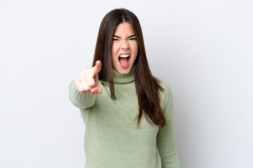 Wall Mural - Young Brazilian woman isolated on white background frustrated and pointing to the front