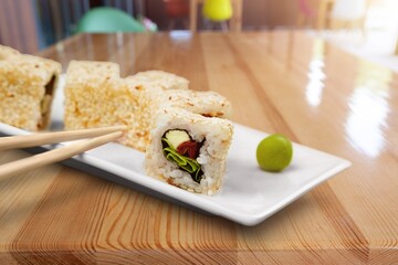 Poster - Wooden chopsticks and tasty fresh sushi dish