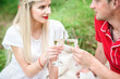 © omelnickiy - couple in love at a picnic in a park with green grass