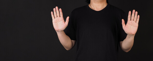 The double wave hand sign on black background.