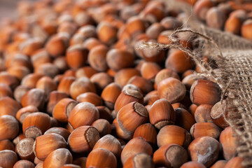 Hazelnuts, filbert on old wooden table. heap or stack of hazel nuts. Hazelnut background, healty food