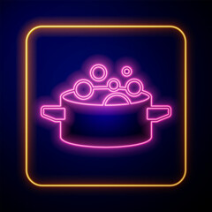 Canvas Print - Glowing neon Cooking pot icon isolated on black background. Boil or stew food symbol. Vector