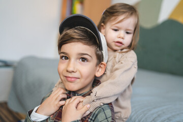 Wall Mural - siblings portrait caucasian boy and girl brother and sister at home