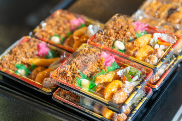 Japanese bento lunch boxes selling in convenience store. Japanese take away fast food and ready to eat on shelf in supermarket.