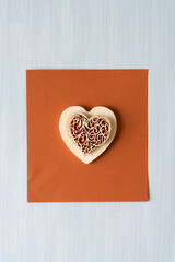 Wall Mural - decorative hearts on smooth brown and patterned blue paper