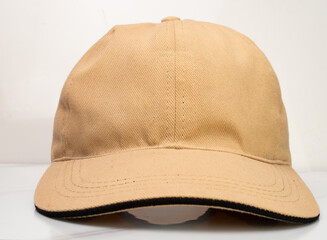 Brown baseball hat on a white background