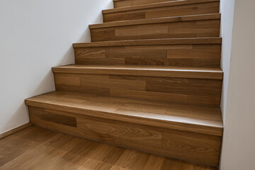 Wall Mural - wooden stairs in modern building, closeup