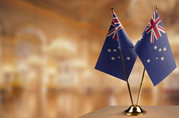 Small flags of the Australia on an abstract blurry background