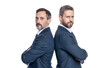 © be free - leader businessmen partners back to back. leadership of leader businessmen partners in studio