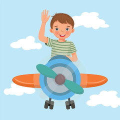 Poster - happy little boy flying an airplane waving hand in the blue sky