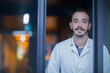 © Cavan Images - Portrait of a young male scientist working in an optical laboratory, Freiburg im Breisgau, Baden-Württemberg, Germany