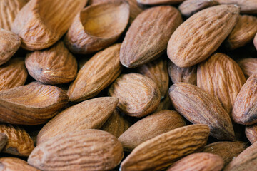 Wall Mural - Almond nuts close. Background of almond nuts. Pile of almonds cl