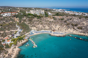 Canvas Print - Konnos Beach in Konnos Bay in area of Cape Greco National Forest Park in Cyprus, view with Grecian Park Hotel