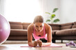 © ivanko80 - Attractive woman exercising at home