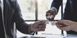 © Natee Meepian - Business people with jigsaw puzzle pieces in office, Successful teamwork and partnership concept. hands holding pieces of white jigsaw puzzle