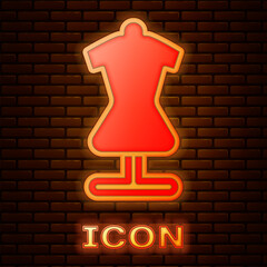 Poster - Glowing neon Mannequin icon isolated on brick wall background. Tailor dummy. Vector