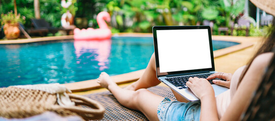 Vacation Woman working on her laptop in holiday  remote online working digital Freelance work concept