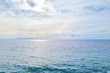 Wall Mural - View from a height of the waters of the Atlantic Ocean and the blue sky.