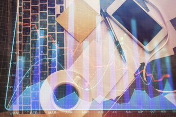 Wall Mural - Double exposure of financial chart drawing over table background with computer. Concept of research and analysis. Top view.