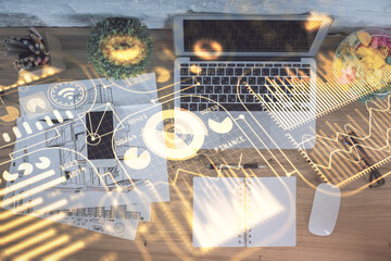 Fototapete - Technology hologram drawing over computer on the desktop background. Top view. Double exposure. Tech concept.