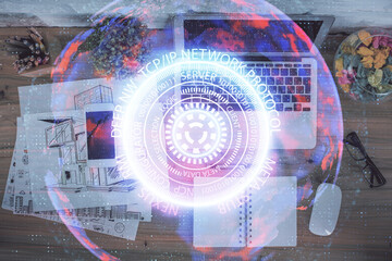 Fototapete - Technology hologram drawing over computer on the desktop background. Top view. Double exposure. Tech concept.