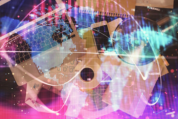 Fototapete - Business theme hologram drawings over computer on the desktop background. Top view. Multi exposure. Concept of international connections.