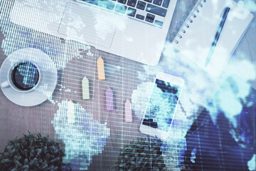 Fototapete - Double exposure of business theme hologram over desktop with phone. Top view. Mobile international trade connection concept.