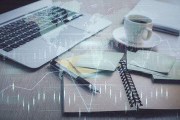 Wall Mural - Multi exposure of forex graph drawing and desktop with coffee and items on table background. Concept of financial market trading