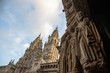 stone statues and the towers of the Cathedral in Santiago de Compostela, Spain