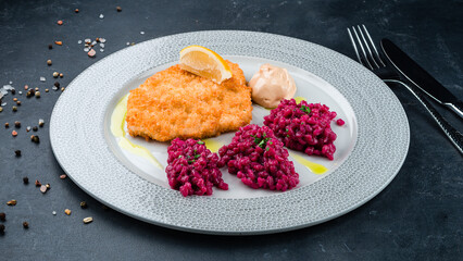 Sticker - Fried chicken fillet with rice in beetroot sauce.